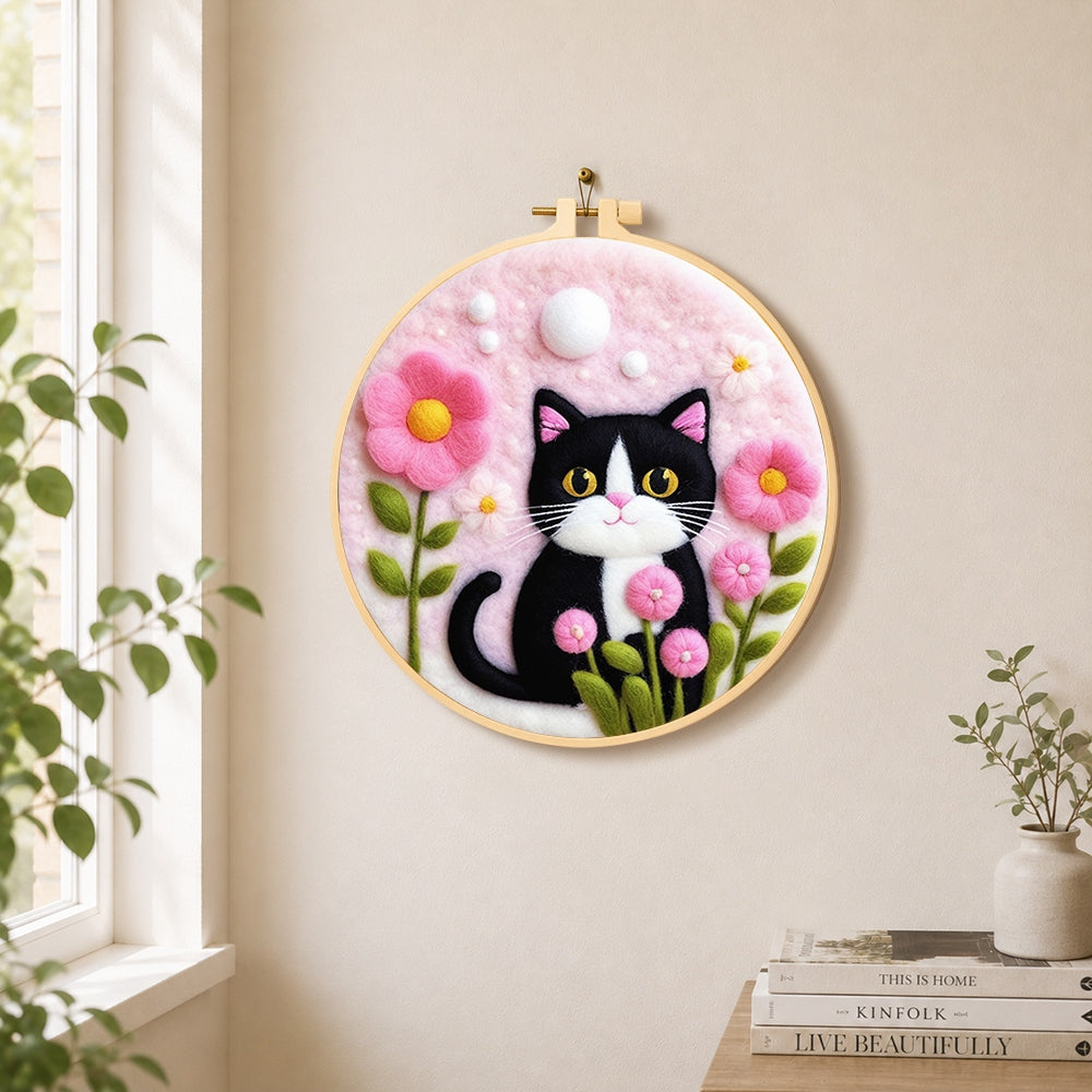 Sweet cat with pink flowers needle felt wall art displayed in a bright home interior