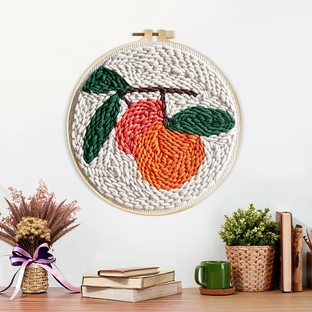 Finished sweet fruit with leaves artwork displayed on a wall