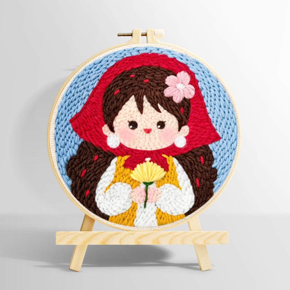 Sweet girl in red scarf holding flowers punch needle kit for beginners