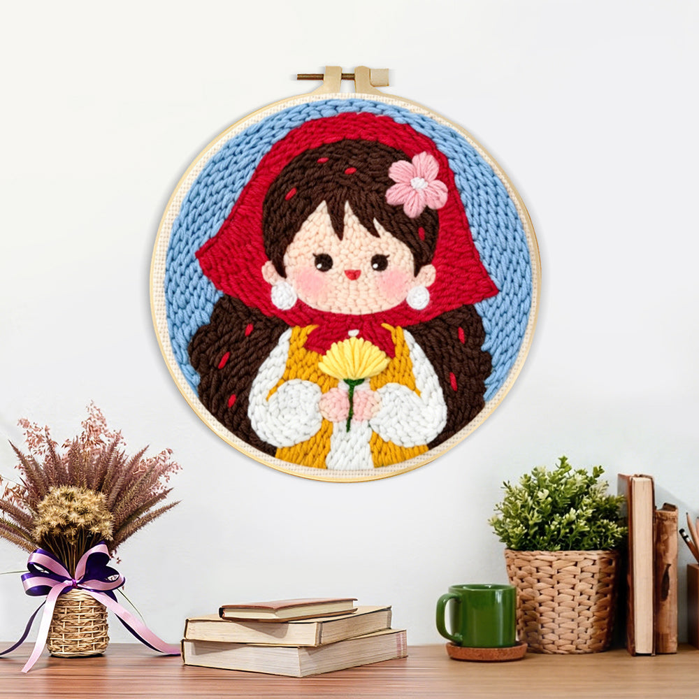 Finished sweet girl in red scarf holding flowers artwork displayed on a wall