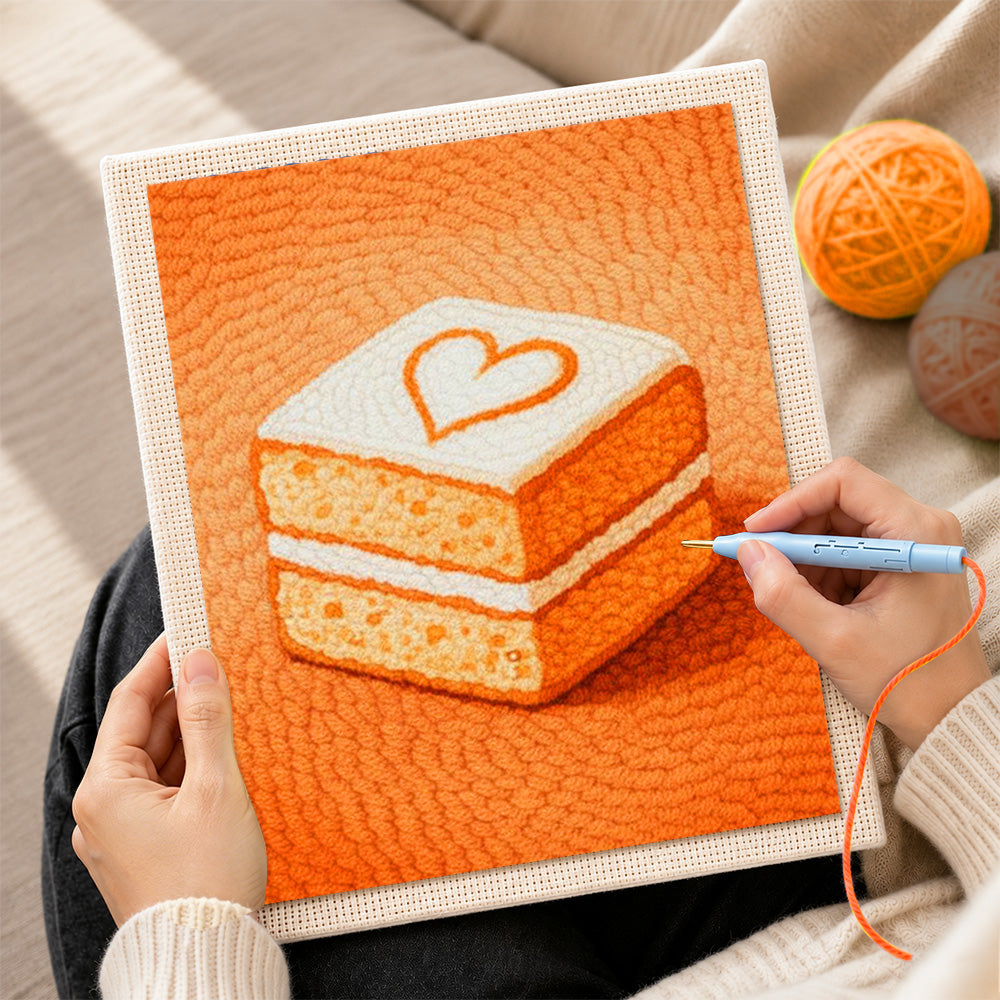 Creating handmade sweet layered cake with heart punch needle artwork