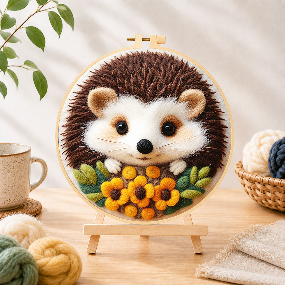 Finished sweet little hedgehog with floral accents needle felting displayed on a wooden easel