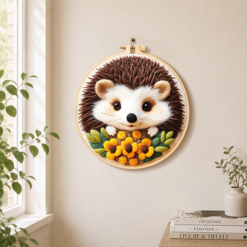 Sweet little hedgehog with floral accents needle felt wall art displayed in a bright home interior