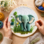 Creating the sweet mint green elephant and plants wool painting by hand with a felting needle
