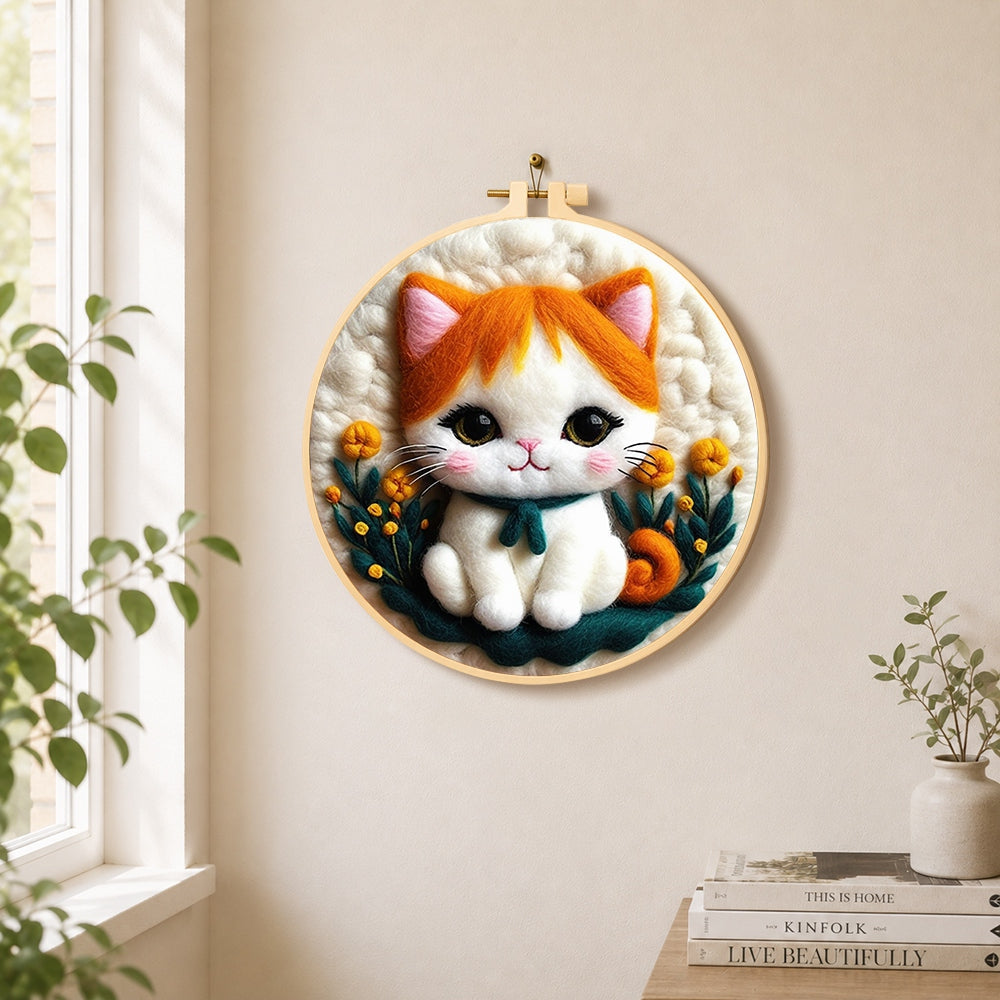 Sweet orange and white kitten needle felt wall art displayed in a bright home interior