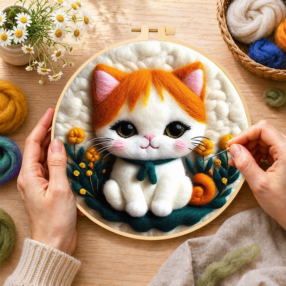 Creating the sweet orange and white kitten wool painting by hand with a felting needle