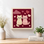 Finished sweet pink and cream cat couple artwork displayed on a wall