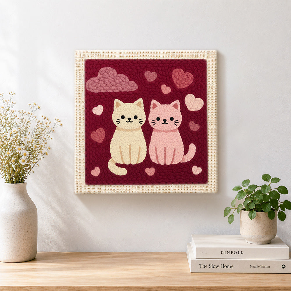 Finished sweet pink and cream cat couple artwork displayed on a wall