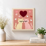 Finished sweet pink and cream cat pair with large heart artwork displayed on a wall