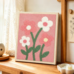 Sweet pink and white flowers punch needle artwork displayed on a table