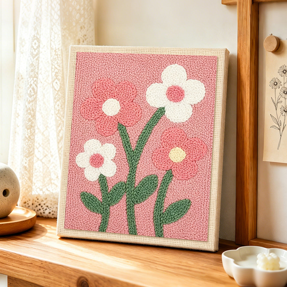 Sweet pink and white flowers punch needle artwork displayed on a table