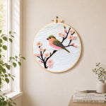 Sweet pink blossom bird needle felt wall art displayed in a bright home interior