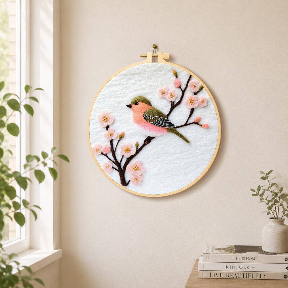 Sweet pink blossom bird needle felt wall art displayed in a bright home interior