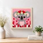 Finished sweet pink koala with heart flower crown artwork displayed on a wall