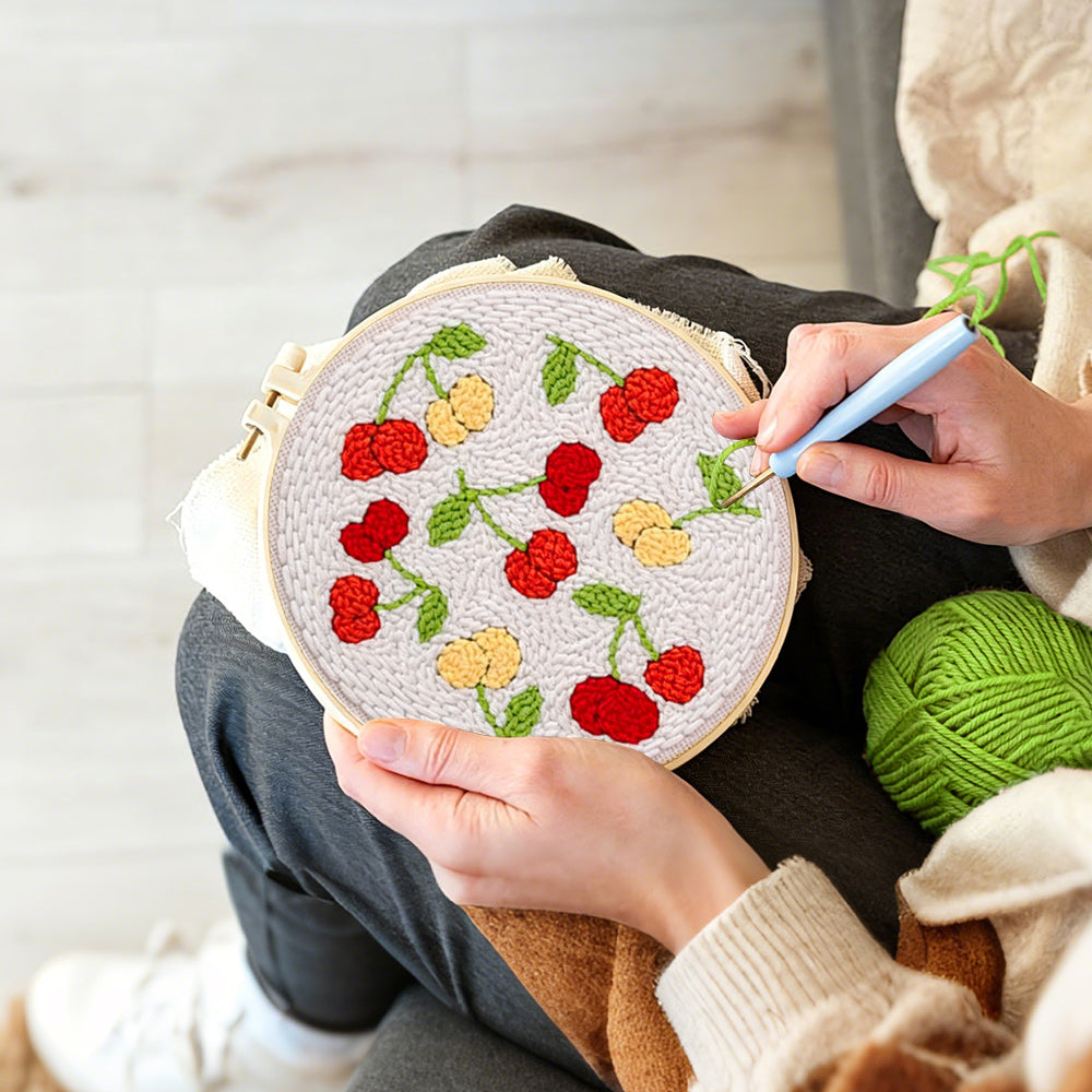 Creating handmade sweet red and yellow cherries punch needle artwork