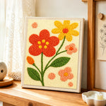 Sweet red and yellow flowers punch needle artwork displayed on a table