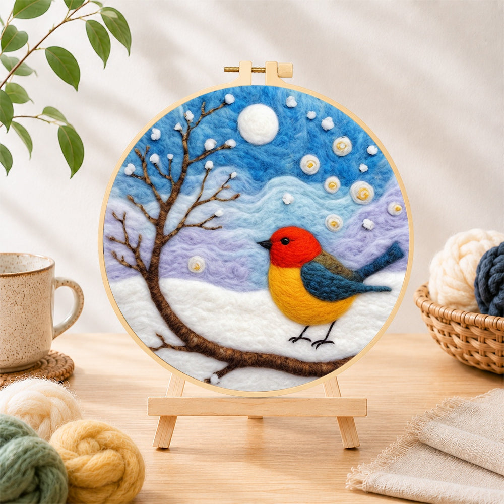 Finished sweet red and yellow winter robin needle felting displayed on a wooden easel
