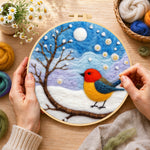 Creating the sweet red and yellow winter robin wool painting by hand with a felting needle