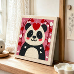 Sweet red heart panda punch needle artwork displayed on a table