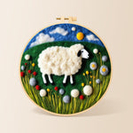 Sweet sheep on a green rolling hill needle felting kit for beginners with a round wooden frame