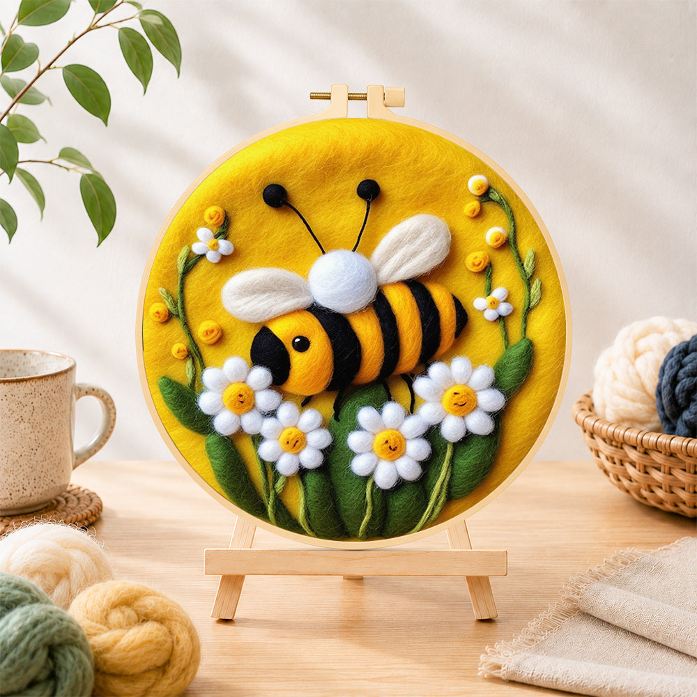 Finished sweet smiling bee with daisies needle felting displayed on a wooden easel