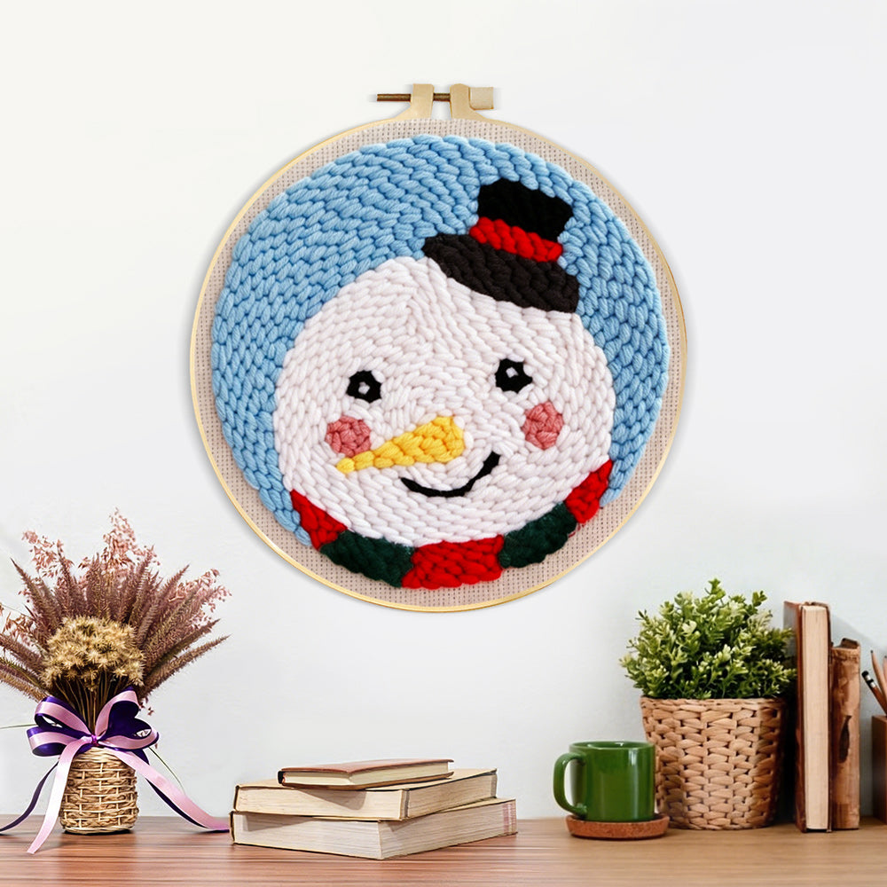 Finished sweet snowman with top hat artwork displayed on a wall