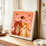 Sweet snuggling cat couple punch needle artwork displayed on a table