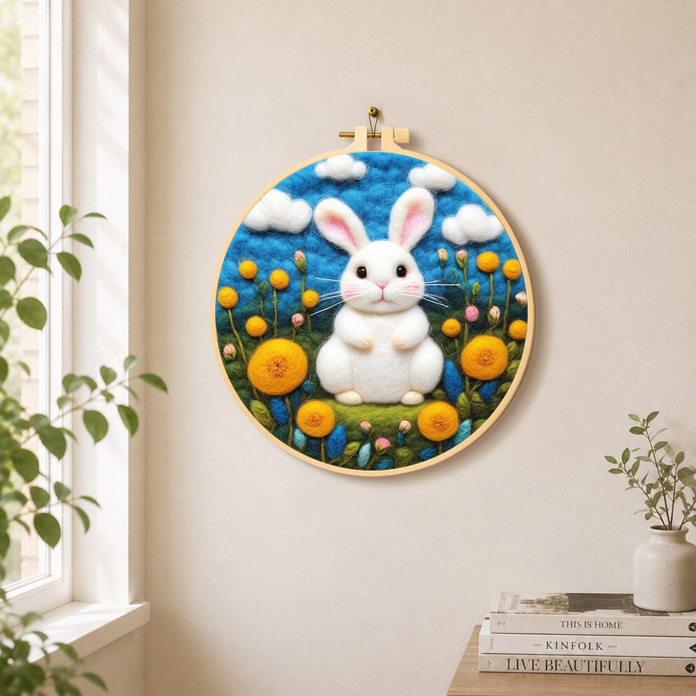 Sweet white bunny among yellow flowers needle felt wall art displayed in a bright home interior