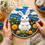 Creating the sweet white bunny among yellow flowers wool painting by hand with a felting needle