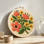 Sweet yellow and orange flowers punch needle artwork displayed on a table
