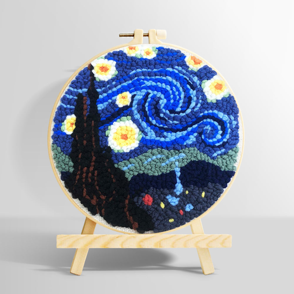Swirling blue night sky with glowing stars punch needle kit for beginners