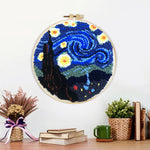 Finished swirling blue night sky with glowing stars artwork displayed on a wall