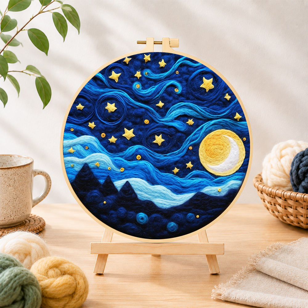 Finished swirling night sky with stars and blue clouds needle felting displayed on a wooden easel