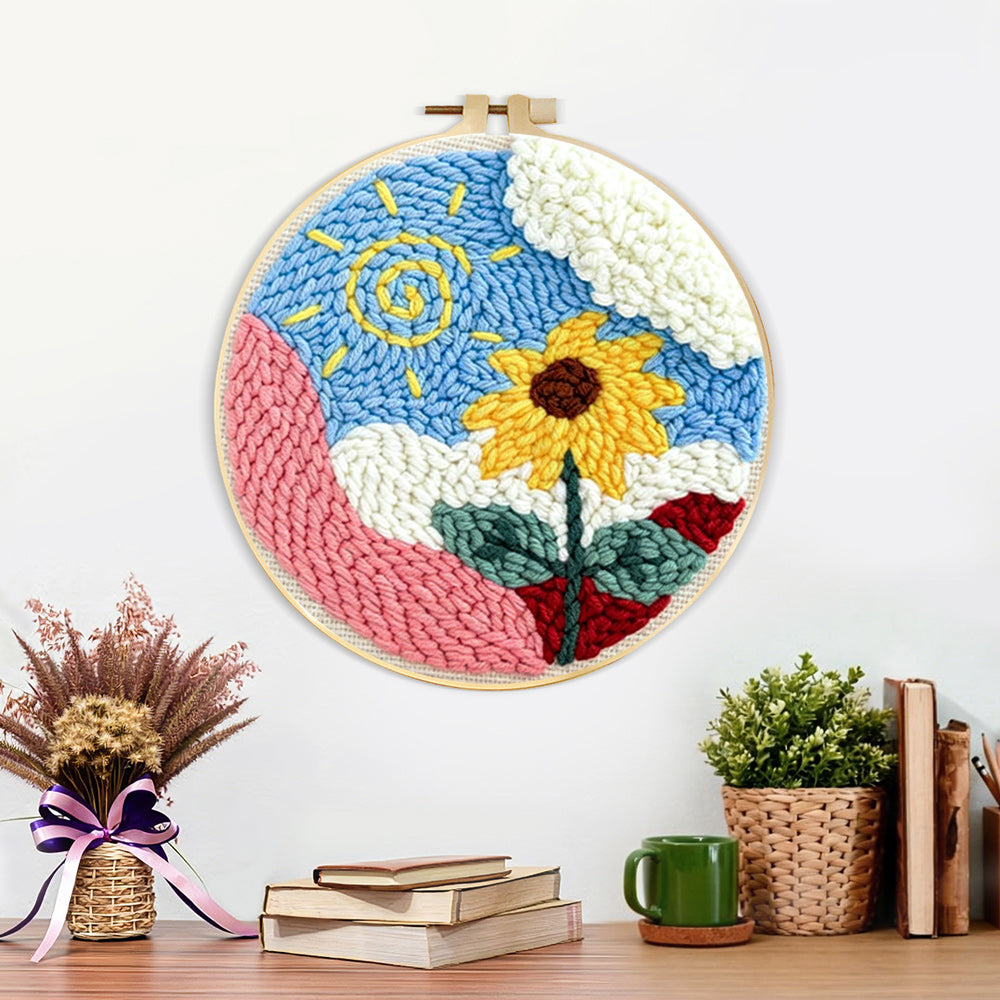 Finished swirly sun and cheerful sunflower artwork displayed on a wall