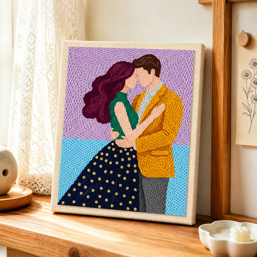 Tender embrace punch needle artwork displayed on a table