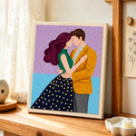 Tender embrace punch needle artwork displayed on a table