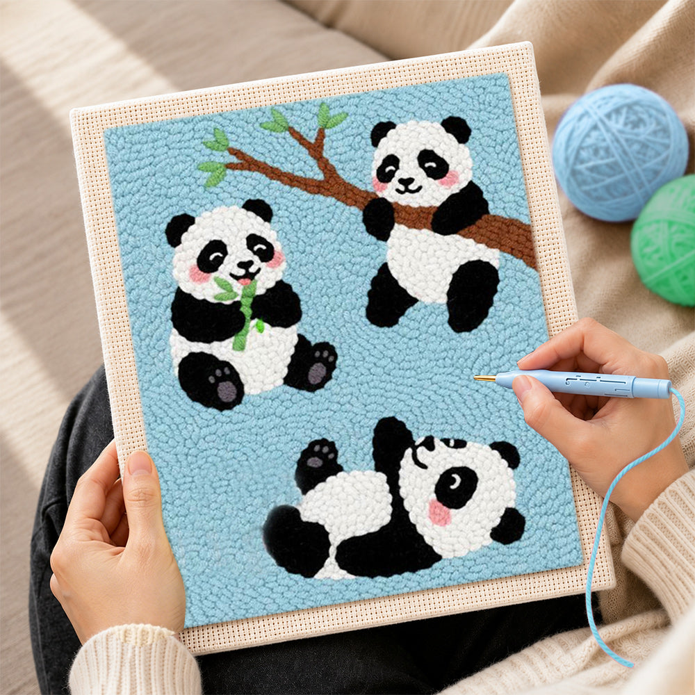 Creating handmade three playful pandas punch needle artwork