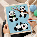 Creating handmade three playful pandas punch needle artwork