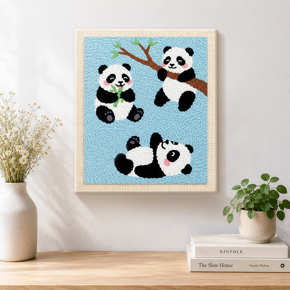 Finished three playful pandas artwork displayed on a wall