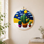 Three potted cactus under the starry night needle felt wall art displayed in a bright home interior
