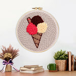 Finished three-scoop ice cream cone artwork displayed on a wall