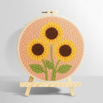 Three sunflowers on peachy pink punch needle kit for beginners