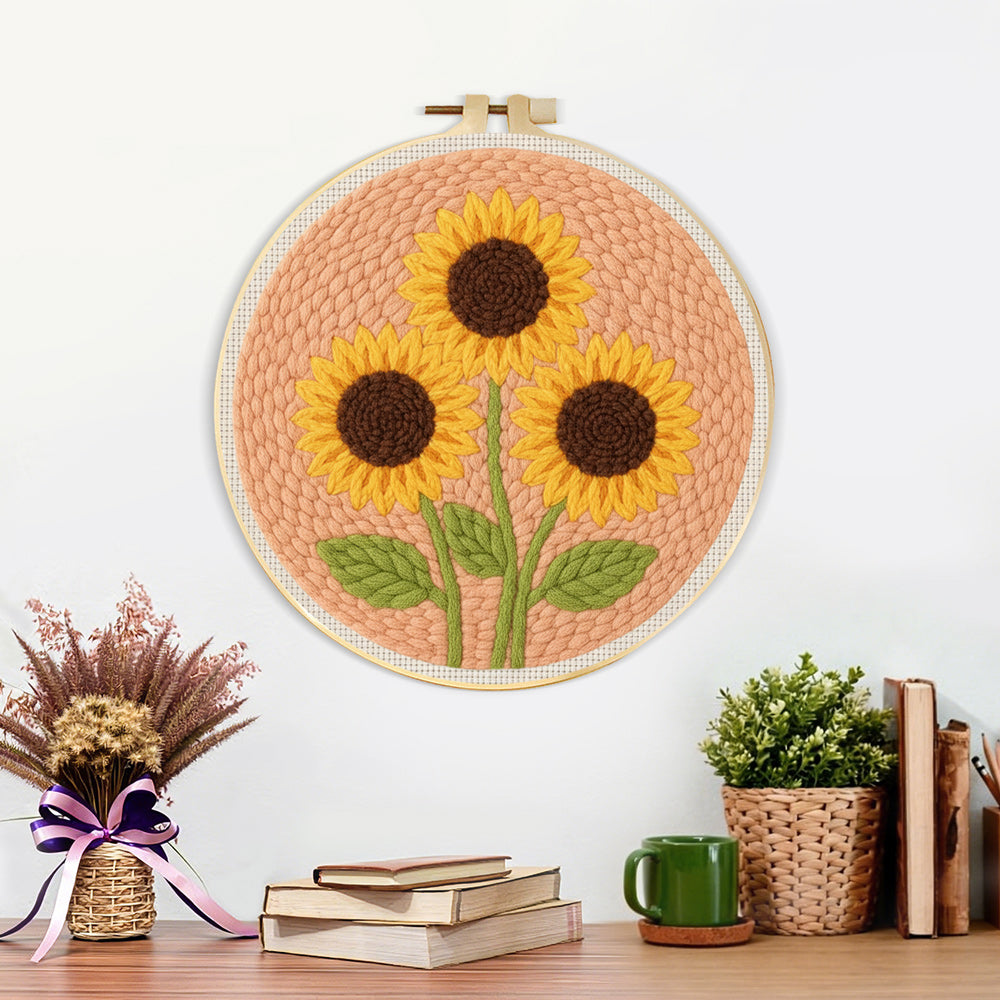 Finished three sunflowers on peachy pink artwork displayed on a wall