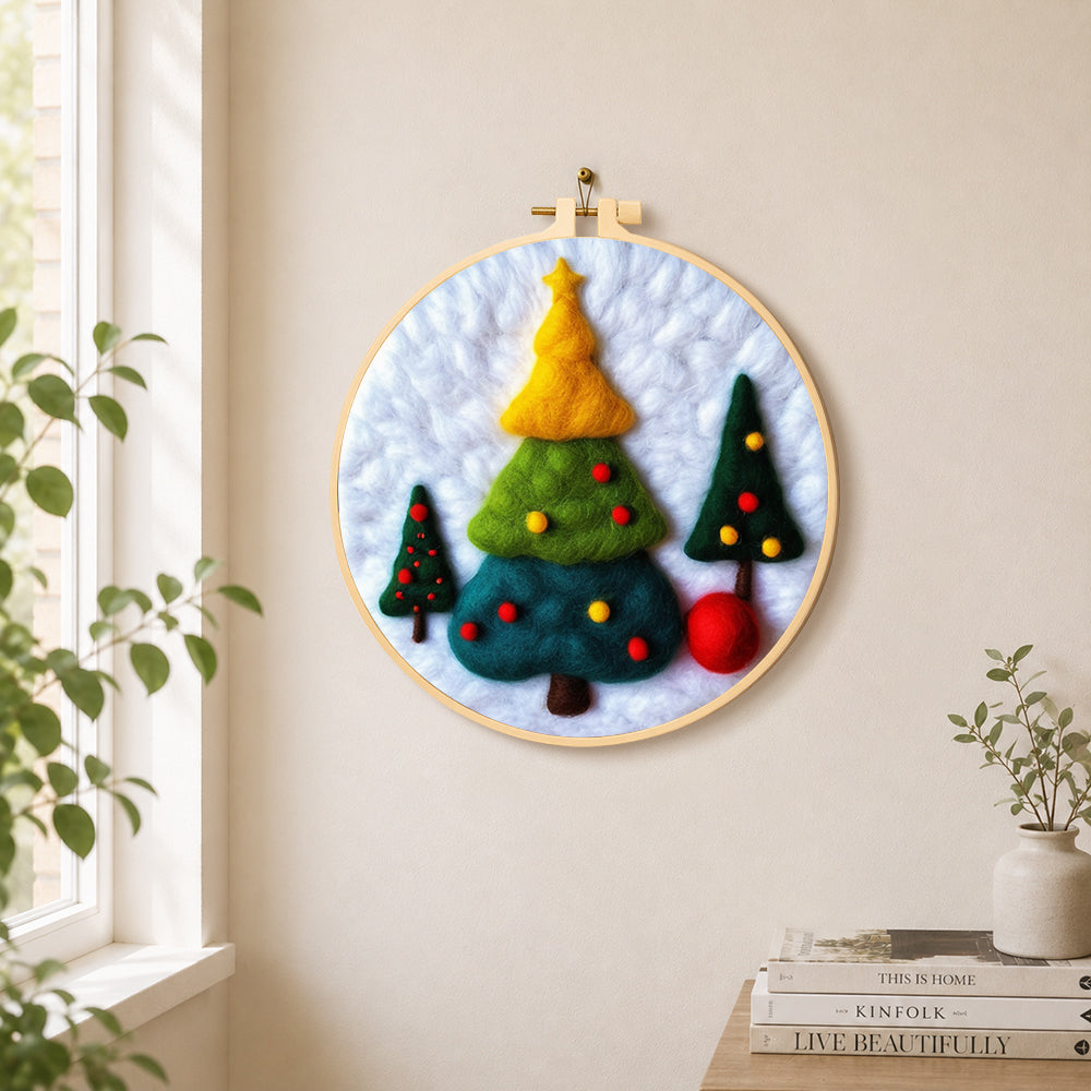 Three tiered christmas trees needle felt wall art displayed in a bright home interior