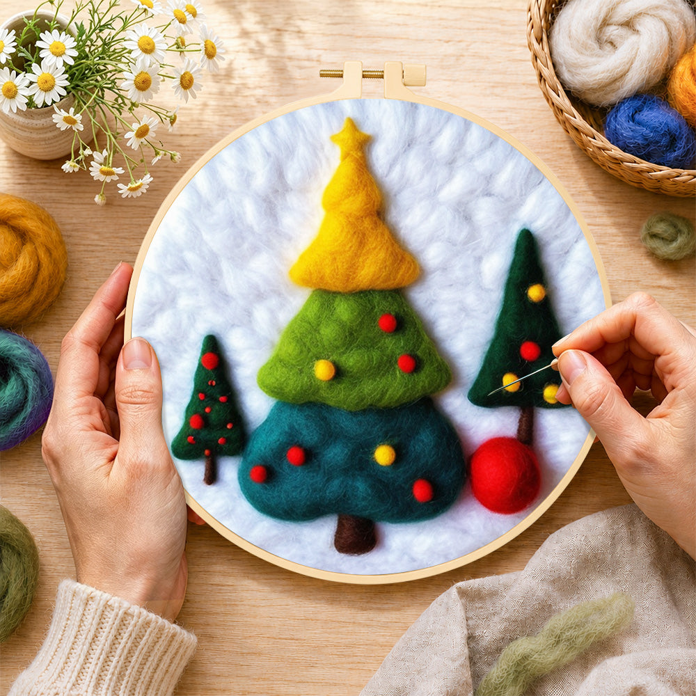 Creating the three tiered christmas trees wool painting by hand with a felting needle