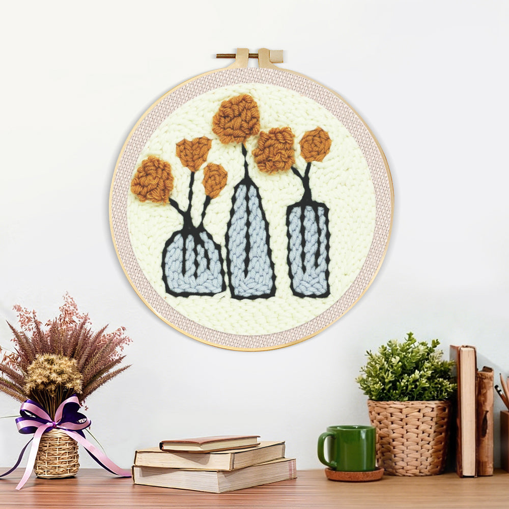 Finished three vases with flowers artwork displayed on a wall