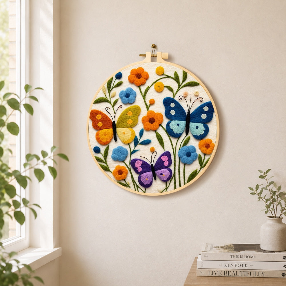 Three whimsical butterflies among flowers needle felt wall art displayed in a bright home interior