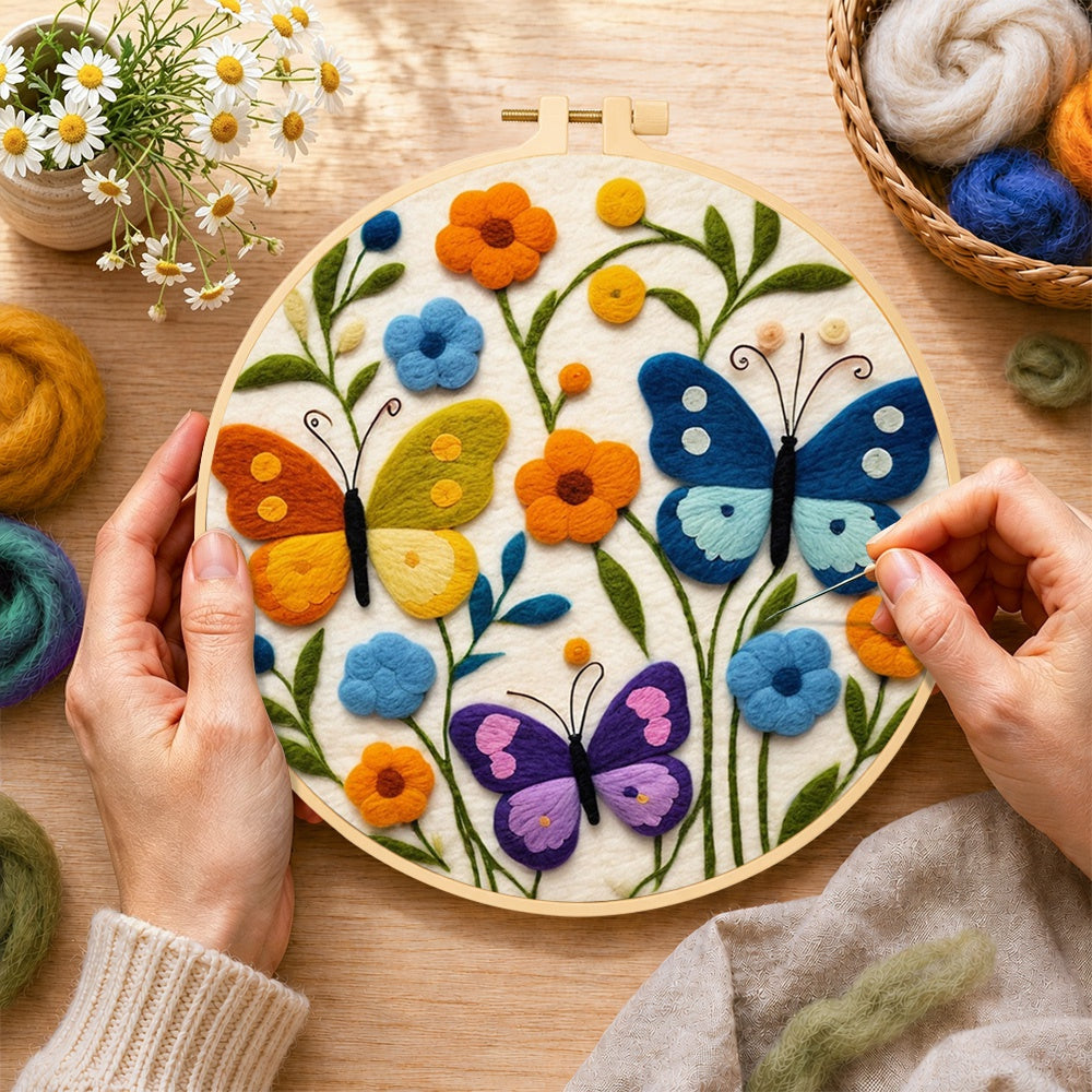 Creating the three whimsical butterflies among flowers wool painting by hand with a felting needle