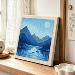 Tranquil blue fjord and boats punch needle artwork displayed on a table