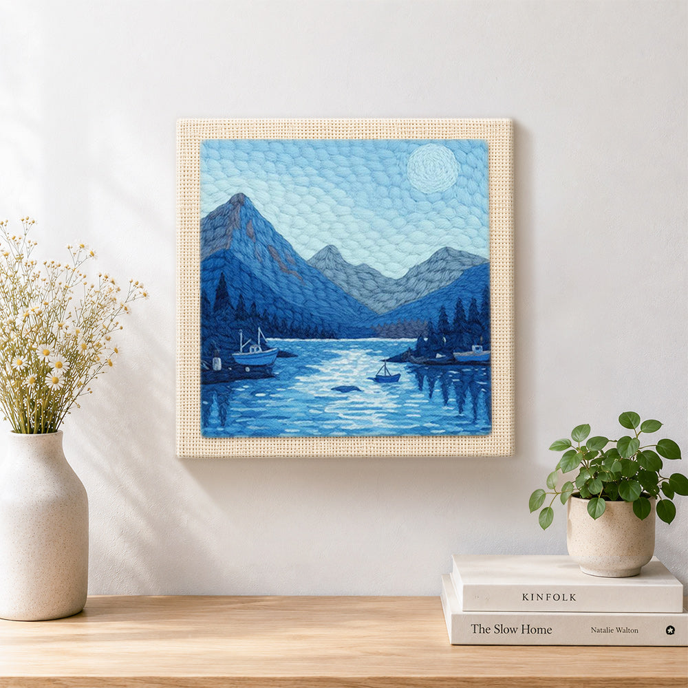 Finished tranquil blue fjord and boats artwork displayed on a wall
